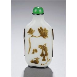 A brown glass on white overlay snuff bottle.