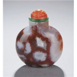 A rounded carnelian snuff bottle.