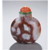 Image 1 : A rounded carnelian snuff bottle.