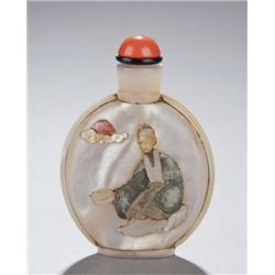 A mother of pearl snuff bottle, embellished.