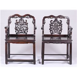 Pair of carved mahogany Chinese throne chairs.