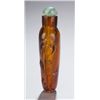Image 2 : Amber glass snuff bottle with tigers on sides.