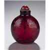 Image 1 : A red glass snuff bottle with incised lotus.