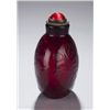 Image 4 : A red glass snuff bottle with incised lotus.