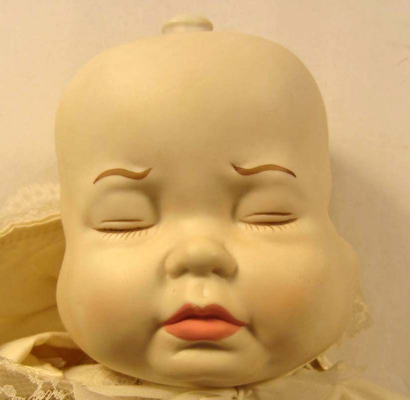 three face porcelain doll