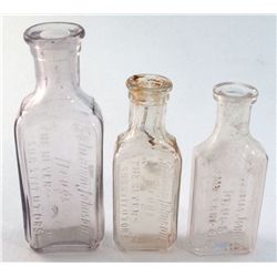 3 different small sized druggists bottles-2 of which are embossed-Schramm-Johnson,/DRUGS/"THE NEVER-
