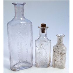 Series of three drugists bottles-E. T. STUDNESS/embossed lion motif w/mortar&pecil/LION DRUG STORE/S