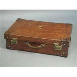A good large Victorian/Edwardian crocodile skin suitcase