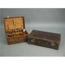 Two Victorian/Edwardian crocodile skin suitcases with fitted interiors