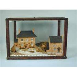 A cork model cottage and watermill in a stained wood and glazed case