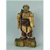 Image 1 : A carved figure of a Chinaman on a rock