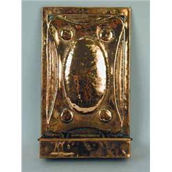 An Arts and Crafts copper wall sconce