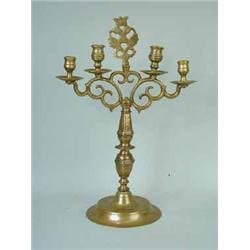A brass four branch candelabra with twin eagle finial