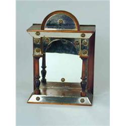 A 19th century mirrored wall sconce in the form of a portico