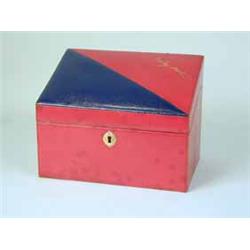 A red and blue leather writing box