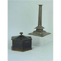 An antique tapering fluted candlestick