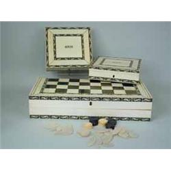 A 19th century Vizigaptanam ivory and sandlewood folding games box engraved and highlighted with lac