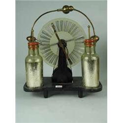 An old 'Wimshurst Machine' c/w Leyden jars and Model Engineer handbook Est.120/15