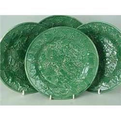 Four late 19th century pottery green moulded leaf plates wit ribbed backs