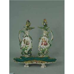 A pair of Coalbrookdale style ewers and covers