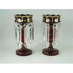 A pair of Victorian cranberry glass lustres