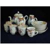 Image 1 : A Chinese export part tea service comprising a teapot and cover