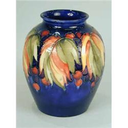 A Moorcroft blue glazed baluster vase