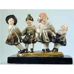 An Italian pottery group of four children