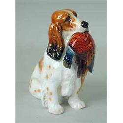 A Royal Doulton figure of a spaniel with a pheasant