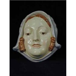 A Royal Doulton face mask of a lady in a bonnet