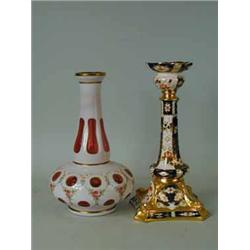 A Royal Crown Derby candlestick in the Imari palette