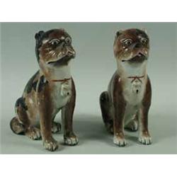 A pair of 18th century Chinese figures of pug dogs