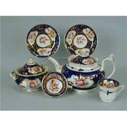 A good 19th century Staffordshire part tea service painted with bouquets of flowers within gilt rese