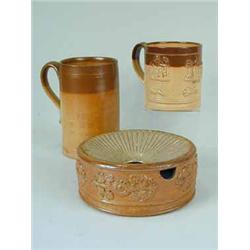 Three 19th century two tone saltglazed items; two cylindrical mugs