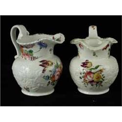 A pair of early 19th century Coalport jugs with painted and moulded decoration