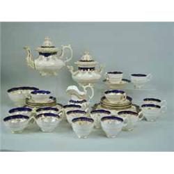 An English 19th century Staffordshire gilt and blue decorated tea set