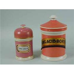 Two pottery drug jars and covers