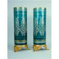 A pair of French ormolu mounted green glass cylindrical vases
