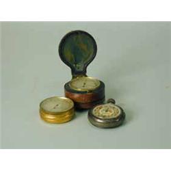 Two pocket barometers: one inscribed 'Husbands... Bristol' with a compass back and leather case