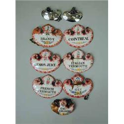 Seven enamel decanter labels