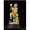 Image 1 : A late l9th/early 20th Century Japanese ivory group of a dancing man and a child with a fan