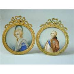 A pair of early 20th Century circular portraits on ivory of Marie Antoinette and King Louis XVI both