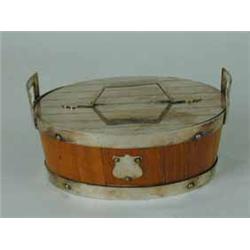 A Victorian coopered oak oval butter dish with silver plates mounts and lid and a ceramic liner