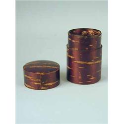 A cherry bark tea caddy of cylindrical form