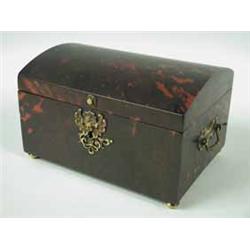 A mid 19th century continental tortoiseshell box with a domed lid and interesting brass mounts