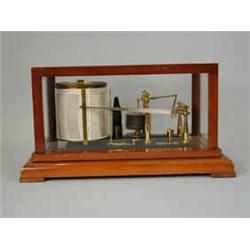 A Negretti and Zambra barograph in a mahogany and glazed cabinet