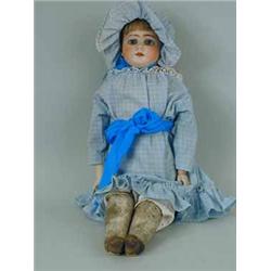 An Ernst Heubach bisque head doll with a kid leather body.  Impressed marks 'DEP 2'