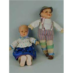 Two Austrian dolls with papier mache heads and fabric bodies