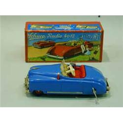A Schuco clockwork 'Radio 4012' tin toy car