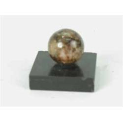 A small Blue John sphere on a slate base